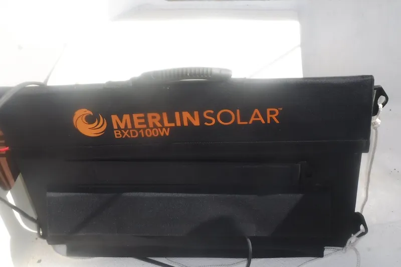 Slide: The Image of Merlin Solar BXD100W panel on a 1975 Carter 3/4 Ton vehicle. - 32