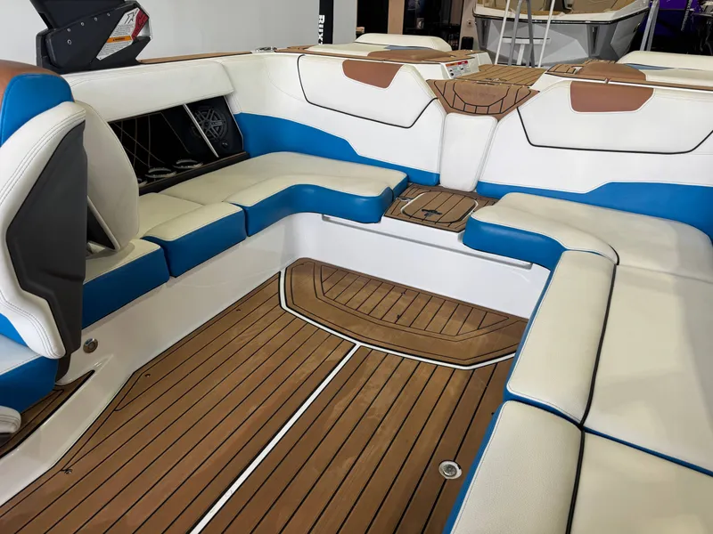 Slide: The Image of Interior of 2019 Nautique Super Air Nautique GS22 with blue and white seating. - 15