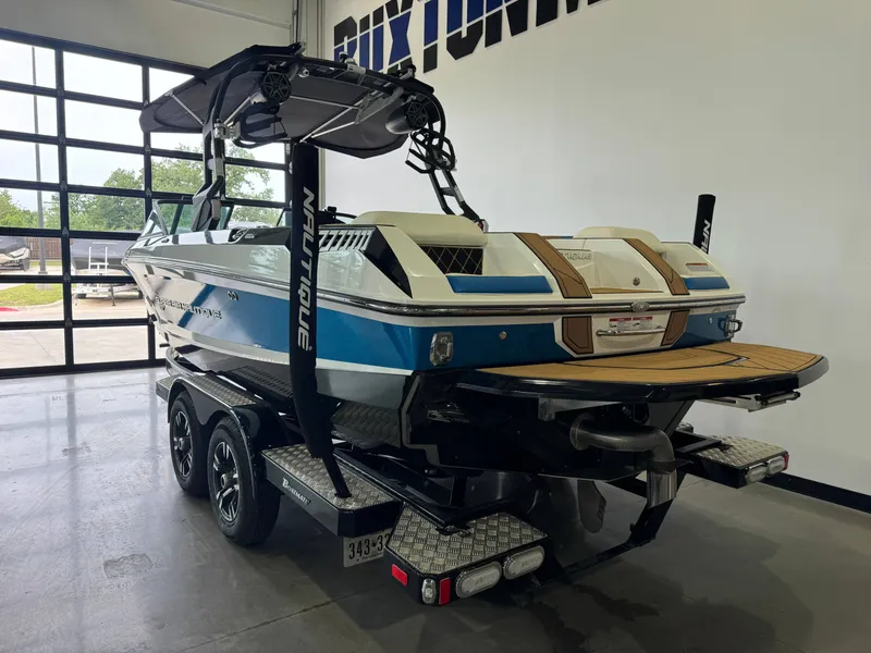Slide: The Image of 2019 Nautique Super Air Nautique GS22 in a garage. - 5