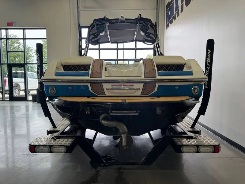 Slide: The Image of 2019 Nautique Super Air Nautique GS22 in a showroom. - 6