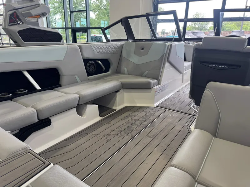 Slide: The Image of Interior of 2023 Nautique Super Air Nautique GS22 with gray seating. - 14