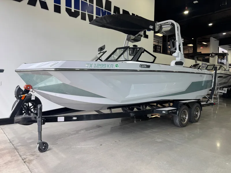 Slide: The Image of 2023 Nautique Super Air Nautique GS22 boat in showroom. - 2