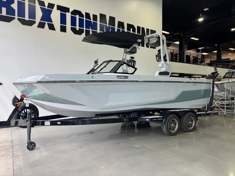 Slide: The Image of 2023 Nautique Super Air Nautique GS22 boat in showroom. - 3