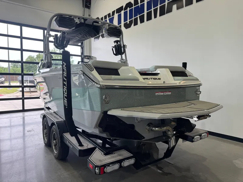 Slide: The Image of 2023 Nautique Super Air Nautique GS22 in a garage. - 5