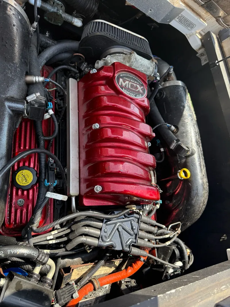 Slide: The Image of 2011 MasterCraft X-2 engine with red MCX Vortec HO cover. - 19