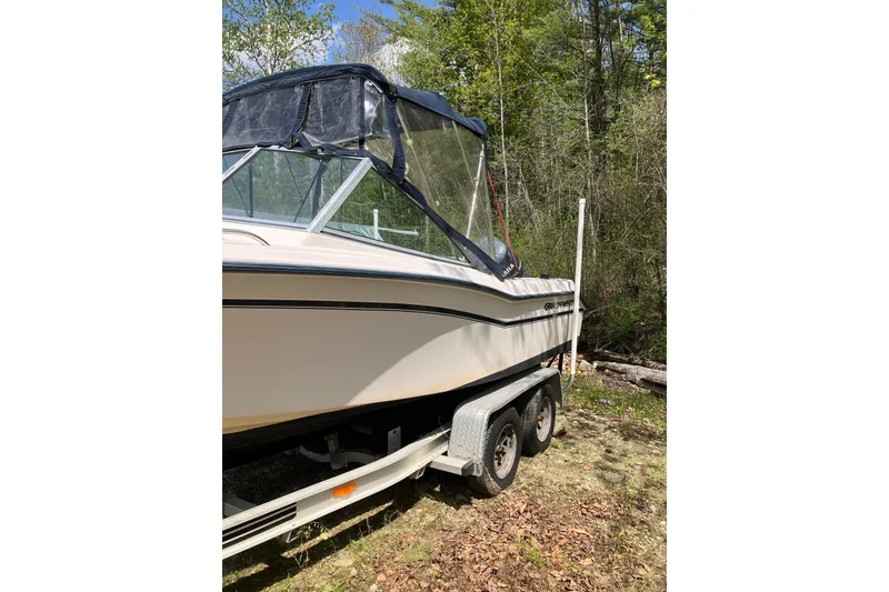 Slide: The Image of 1997 Grady-White Tournament 192 boat on trailer in wooded area. - 3