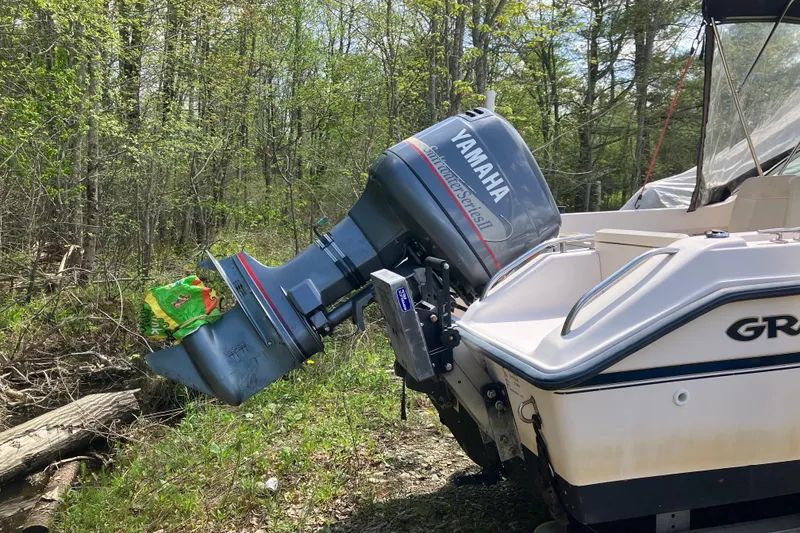 Slide: The Image of 1997 Grady-White Tournament 192 boat with Yamaha outboard motor in a wooded area. - 6