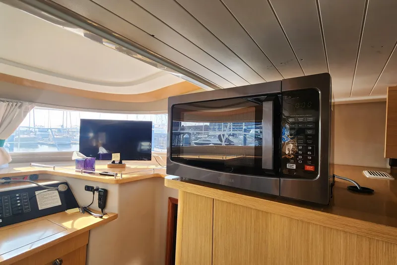 Slide: The Image of Interior of 2013 Fountaine Pujut Summerland 40 with microwave and TV in cabin. - 10