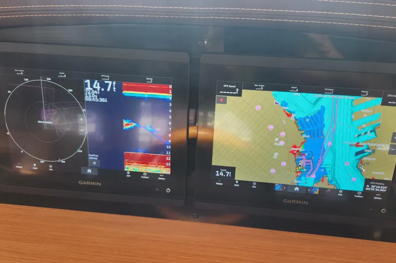 Slide: The Image of Garmin navigation display on 2013 Fountaine Pujut Summerland 40, showing radar and nautical charts. - 13