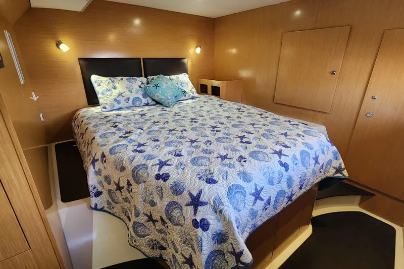 Slide: The Image of Cozy bedroom in 2013 Fountaine Pujut Summerland 40 yacht with nautical-themed bedding. - 17