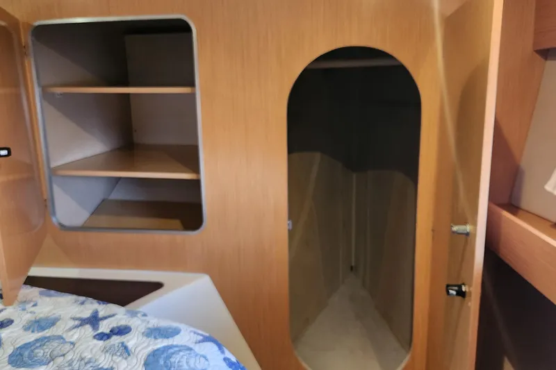 Slide: The Image of Interior of 2013 Fountaine Pujut Summerland 40 with wooden shelves and storage space. - 18