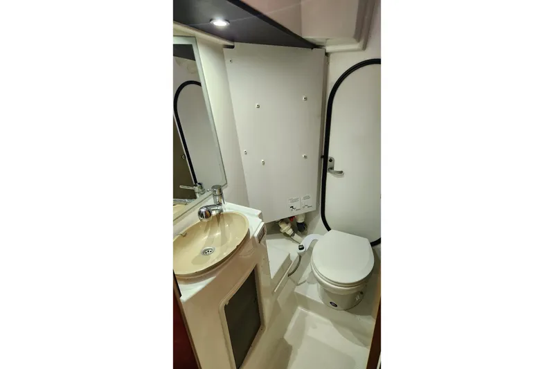 Slide: The Image of Bathroom interior of 2013 Fountaine Pujut Summerland 40 yacht, featuring sink and toilet. - 19