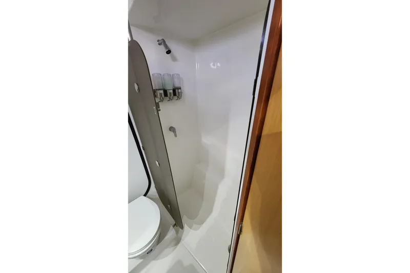 Slide: The Image of Bathroom interior of 2013 Fountaine Pujut Summerland 40 yacht, featuring shower and dispensers. - 21