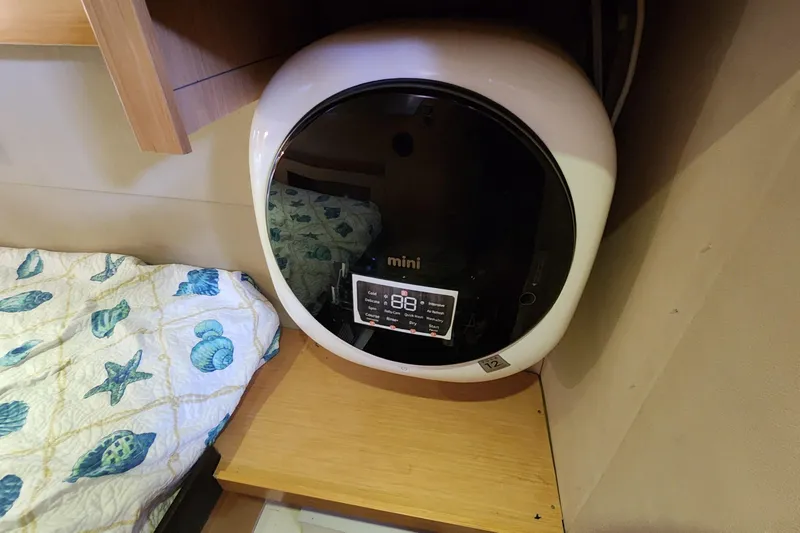 Slide: The Image of Compact mini washing machine in a 2013 Fountaine Pujut Summerland 40 boat cabin. - 24