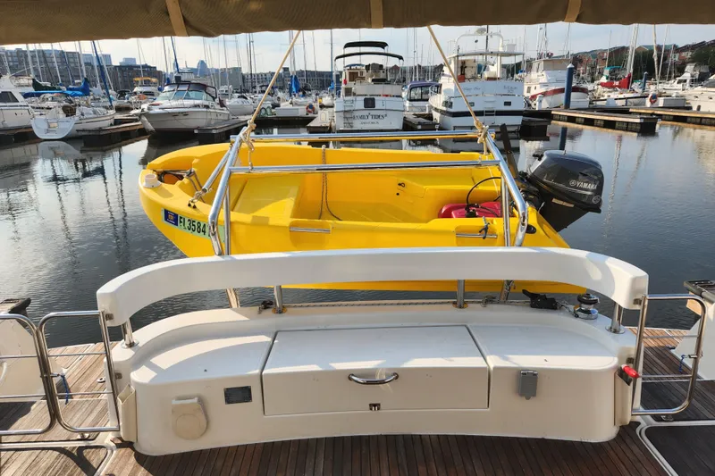 Slide: The Image of Yellow boat docked at marina, viewed from a 2013 Fountaine Pujut Summerland 40. - 3