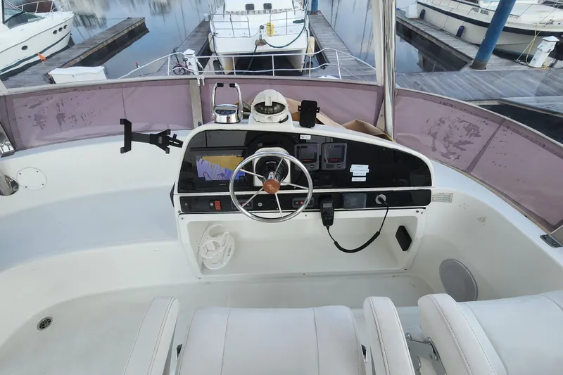 Slide: The Image of Cockpit of 2013 Fountaine Pujut Summerland 40 yacht with steering wheel and navigation equipment. - 31
