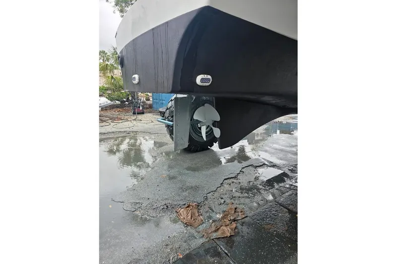 Slide: The Image of 2013 Fountaine Pajot Summerland 40 catamaran hull and propeller on wet pavement. - 41
