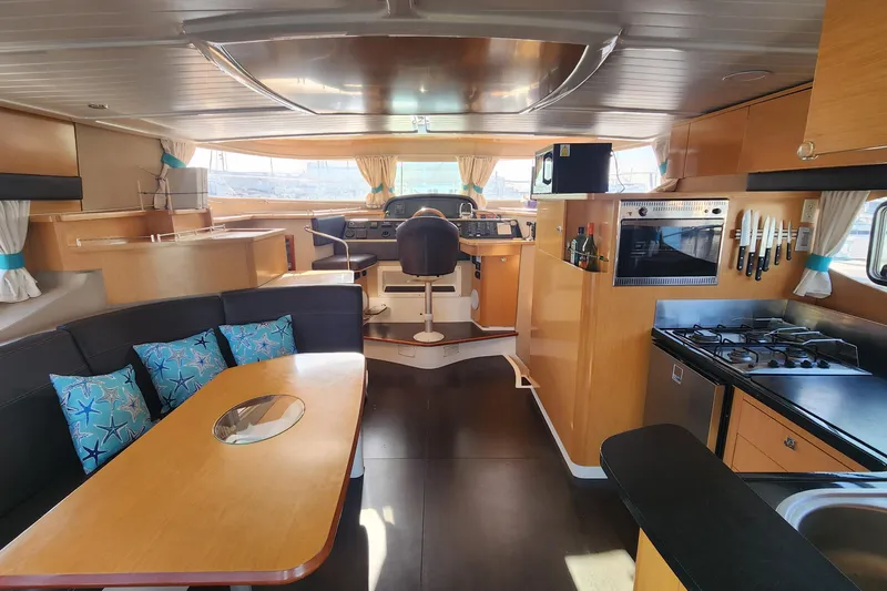 Slide: The Image of Luxurious interior of 2013 Fountaine Pujut Summerland 40 yacht with modern kitchen and seating area. - 5