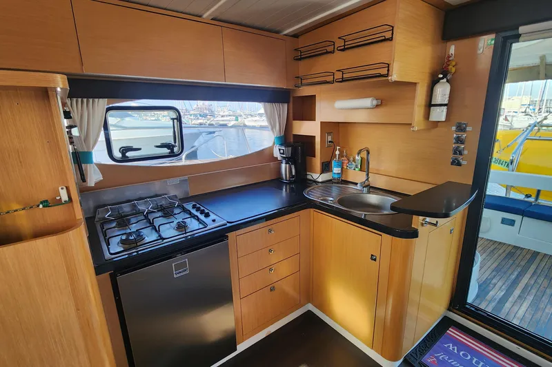 Slide: The Image of Modern kitchen interior of 2013 Fountaine Pujut Summerland 40 yacht with stove and sink. - 6