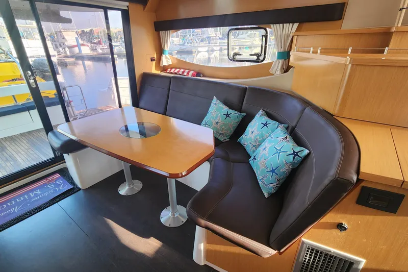 Slide: The Image of Interior of 2013 Fountaine Pujut Summerland 40 yacht with cozy seating and starfish pillows. - 7