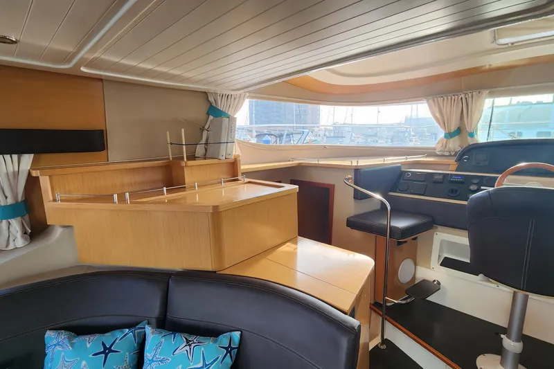 Slide: The Image of Interior of 2013 Fountaine Pujut Summerland 40 yacht with modern helm and seating area. - 8
