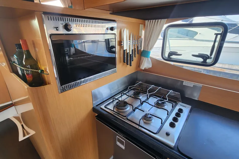 Slide: The Image of Modern kitchen in 2013 Fountaine Pujut Summerland 40 yacht with stove, oven, and knives. - 9