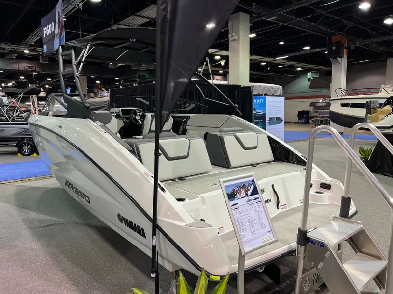 Slide: The Image of Yamaha AR250 2025 boat displayed at a trade show. - 2