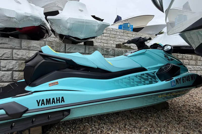 The Image of 2025 Yamaha WaveRunner VX Limited HO in vibrant turquoise, parked on gravel. - 0