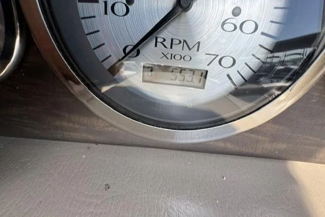 Slide: The Image of Close-up of a 2018 Bennington 22 GSR RPM gauge displaying 553.7 hours. - 4