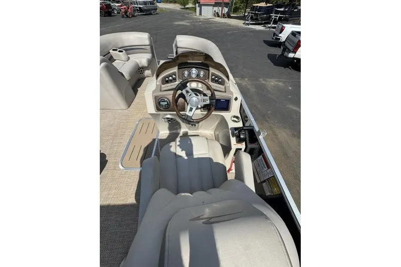Slide: The Image of 2018 Bennington 22 GSR boat interior with steering wheel and dashboard controls. - 6