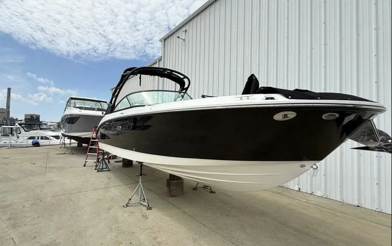 Slide: The Image of 2025 Sea Ray SDX 270 boat on shipyard, side view. - 2