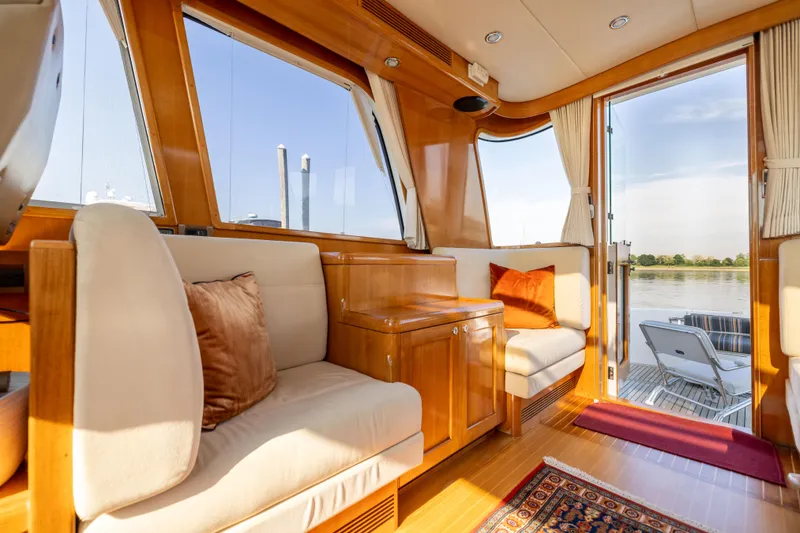 Slide: The Image of Luxurious interior of 2008 Grand Banks 45 Eastbay SX yacht with elegant seating and scenic view. - 10