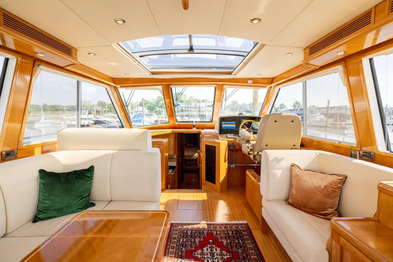 Slide: The Image of Luxurious interior of 2008 Grand Banks 45 Eastbay SX yacht with plush seating and elegant wood finishes. - 15