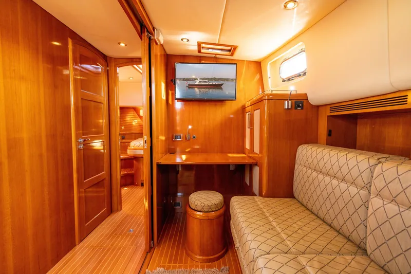 Slide: The Image of Luxurious interior of 2008 Grand Banks 45 Eastbay SX yacht with elegant wood finish. - 19