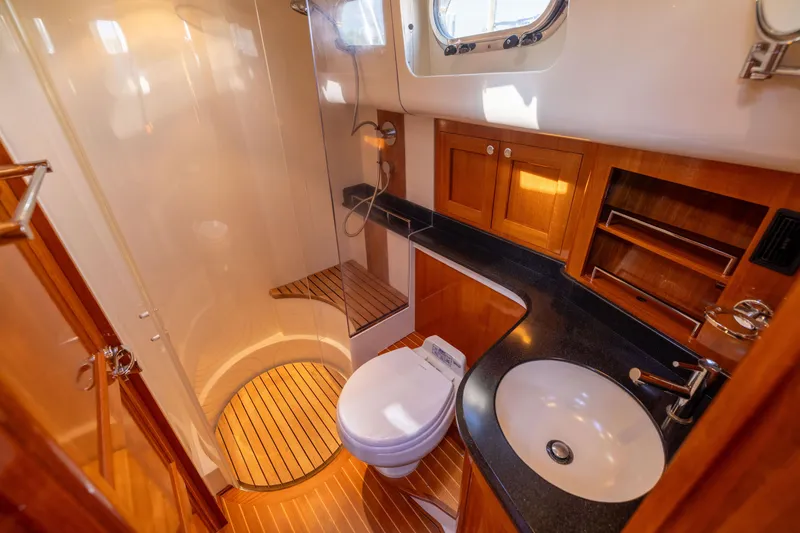 Slide: The Image of Luxurious 2008 Grand Banks 45 Eastbay SX yacht bathroom with wood accents and modern fixtures. - 21