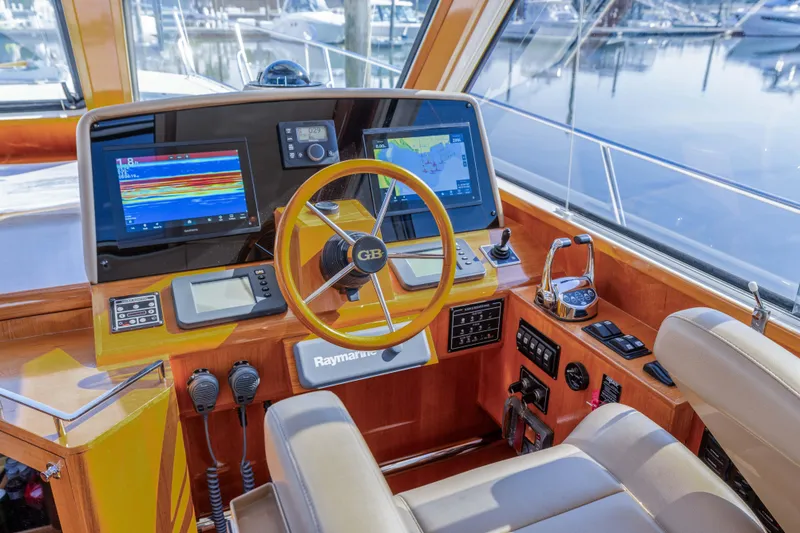 Slide: The Image of Helm of 2008 Grand Banks 45 Eastbay SX with navigation screens and controls. - 6