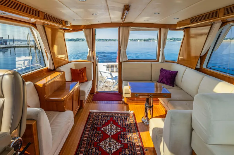 Slide: The Image of Luxurious interior of 2008 Grand Banks 45 Eastbay SX yacht with elegant seating and scenic views. - 7