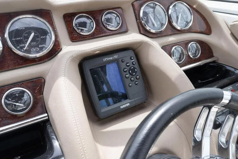 Slide: The Image of Dashboard of a 2007 Cobalt 323 boat with GPS and gauges. - 14