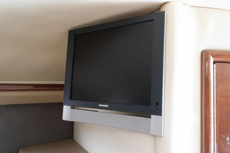 Slide: The Image of Flat-screen TV mounted in a 2007 Cobalt 323 boat interior. - 26