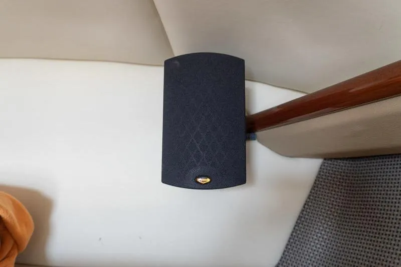 Slide: The Image of Black speaker mounted on a 2007 Cobalt 323 boat interior. - 27