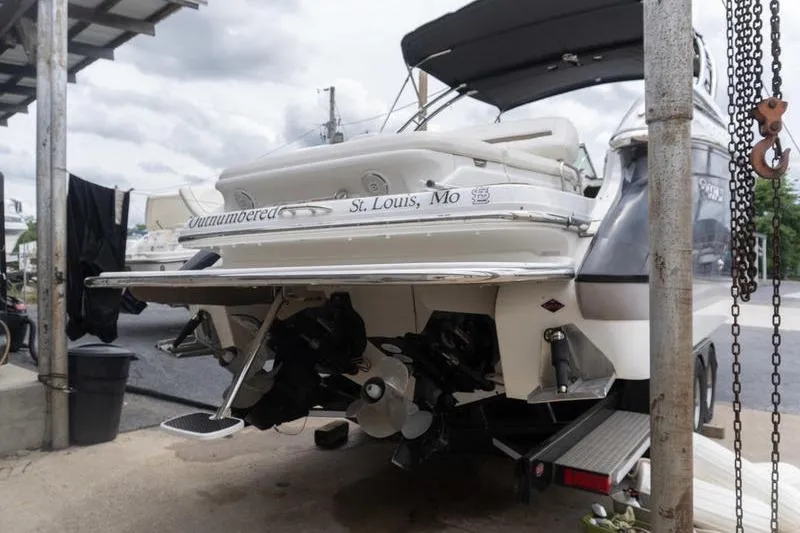 Slide: The Image of Rear view of a 2007 Cobalt 323 boat docked, showing propellers and St. Louis, MO registration. - 3