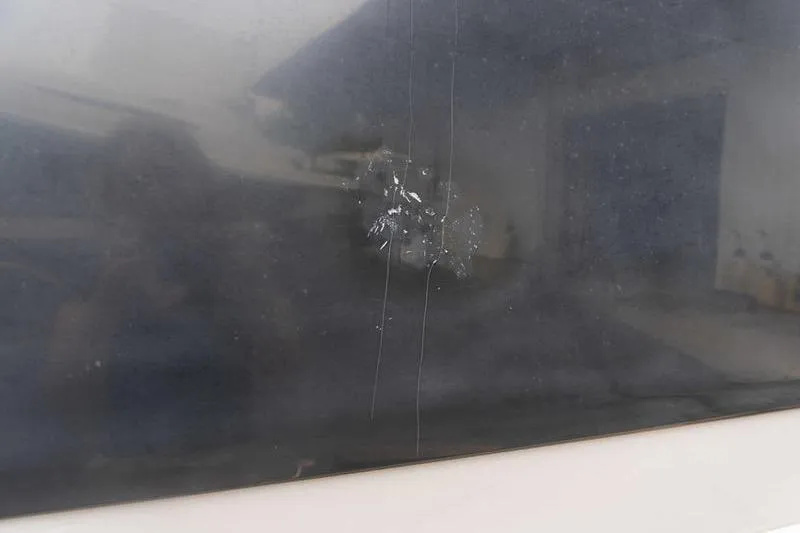 Slide: The Image of Cracked window on a 2007 Cobalt 323 vehicle, showing visible damage. - 37