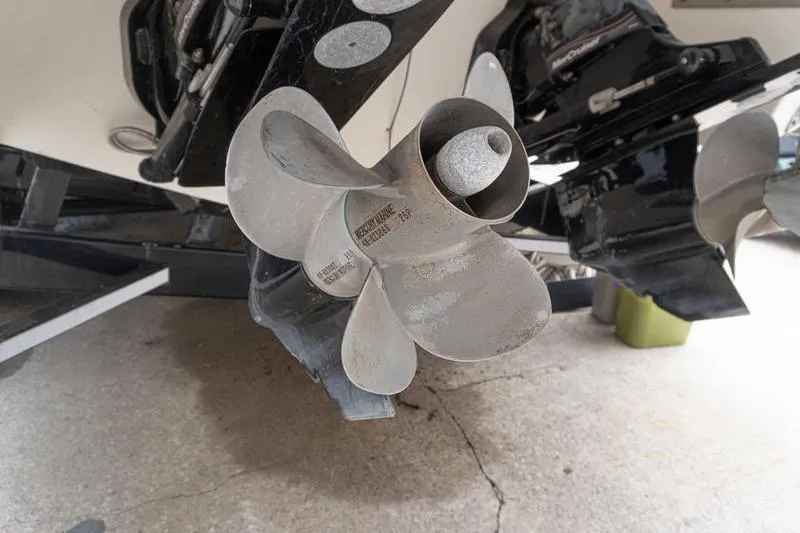 Slide: The Image of Close-up of a 2007 Cobalt 323 boat propeller on a concrete surface. - 5