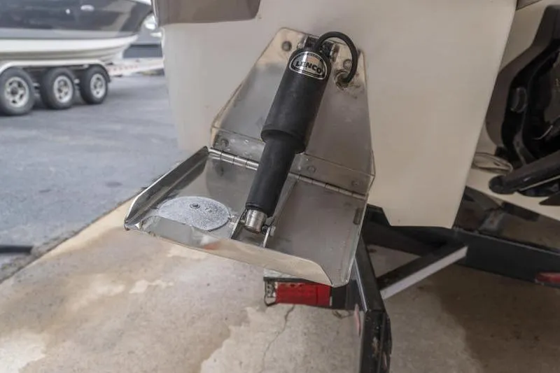 Slide: The Image of Trim tab on a 2007 Cobalt 323 boat, featuring a Bennco actuator. - 6