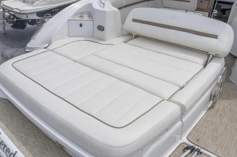 Slide: The Image of 2007 Cobalt 323 boat with luxurious white leather seating area. - 7