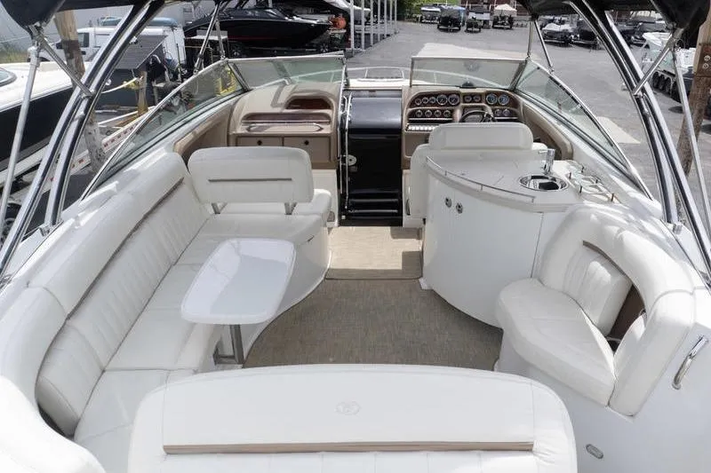 Slide: The Image of Luxurious interior of a 2007 Cobalt 323 boat with white seating and modern dashboard. - 8