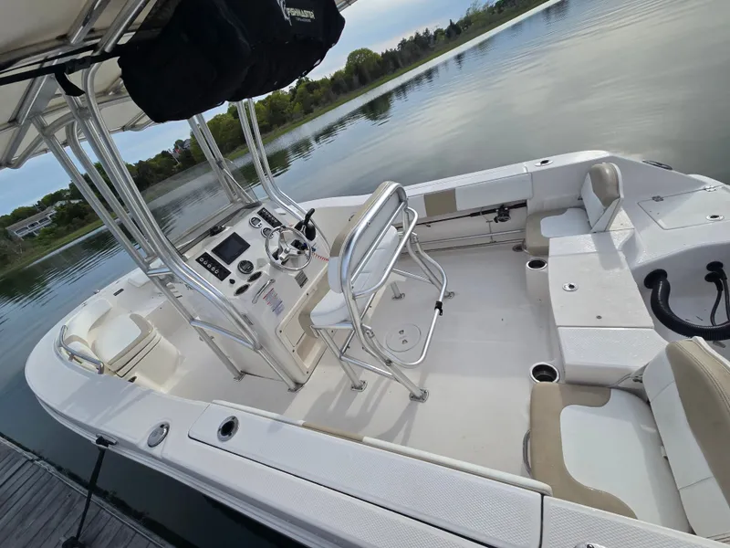 Slide: The Image of 2018 Robalo R200 Center Console boat on calm water. - 10