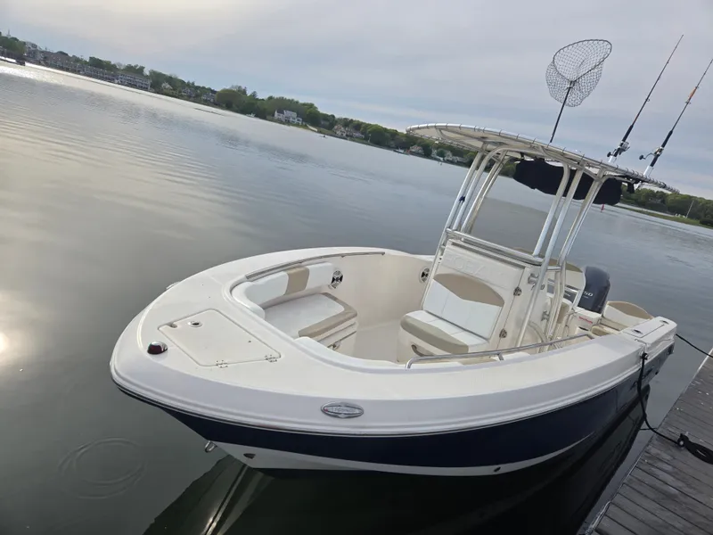 Slide: The Image of 2018 Robalo R200 Center Console boat on calm lake. - 12