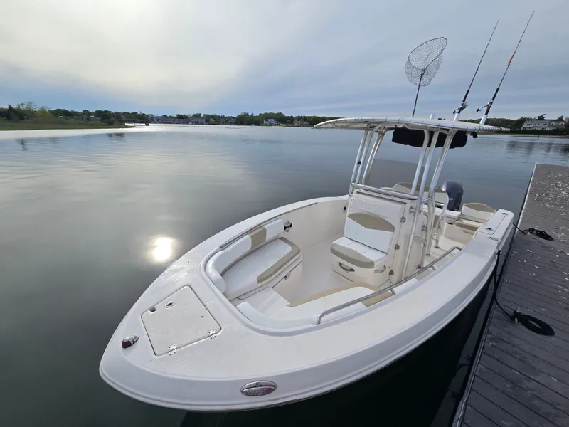 Slide: The Image of 2018 Robalo R200 Center Console boat on calm water. - 8