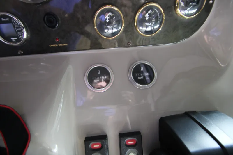 Slide: The Image of Dashboard of 2003 Cruisers Yachts 320 Express with gauges and controls. - 10
